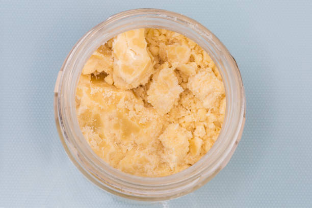 istock Raw cocoa butter in small jar, top view close-up 1471595555