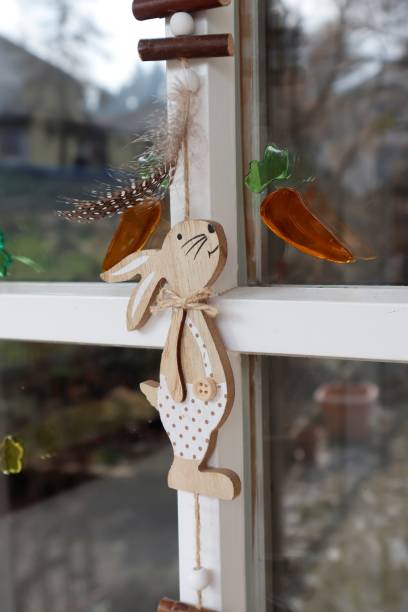 istock Easter decorations on the door. The bunny wants a carrot. 1471596019