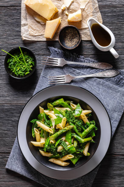 istock Pasta primavera with green veggies, cheese in bowl 1471596723