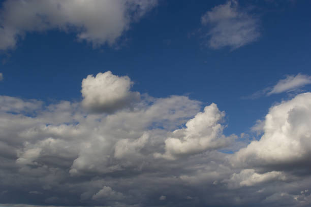 istock clouds in the sky lit by the sun on a summer day. background 1471598514