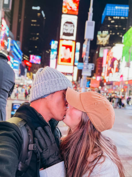 istock Couple taking selfie at time square 1471601449