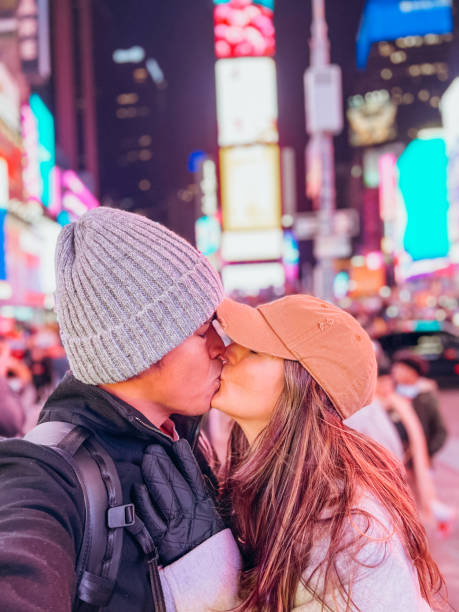 istock Couple taking selfie at time square 1471601720