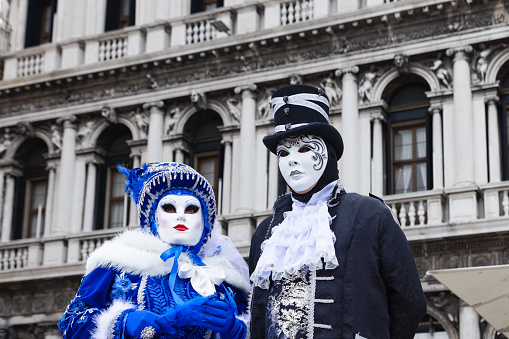 Persons in typical Venetian costume - mask - attends the Carnival of Venice. The Carnival on February 19, 2006 in Venice, Italy.
