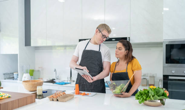 istock A couple learns to cook in their own kitchen. 1471603055