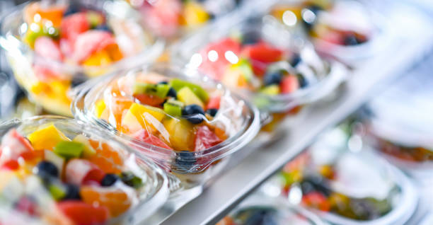 Boxes with pre-packaged fruit salads in a commercial fridge Plastic boxes with pre-packaged fruit salads, put up for sale in a commercial refrigerator food state stock pictures, royalty-free photos & images