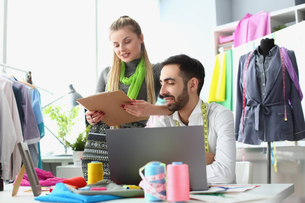 istock Seamstress consults with textile stylist for new collection 1471605129