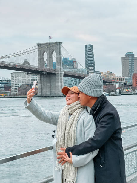 istock Couple taking selfie in NYC with the Brooklyn bridge 1471606174