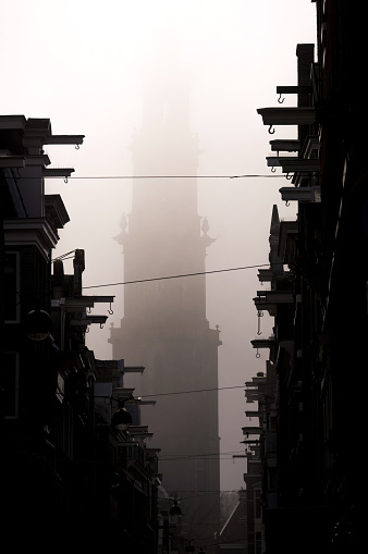 Foggy morning in Amsterdam with the Westerkerk church in the background.