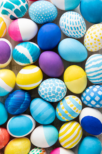 Many colorful decorated painted easter eggs multicolored close up background top view