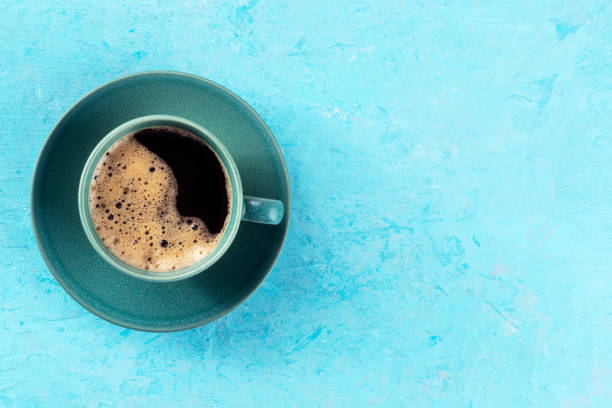istock Coffee cup, shot from above on a blue background with copy space 1471608992