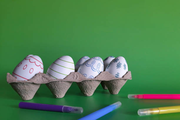 istock Tray with Easter eggs and markers. Copy space. Preparing for holiday with children. 1471609993