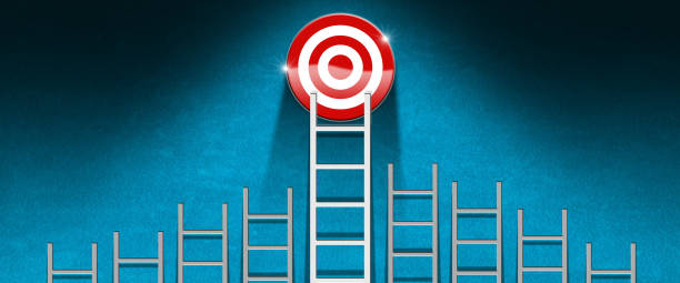istock Group of Ladders and a Target on Blue Wall with Copy Space 1471611650