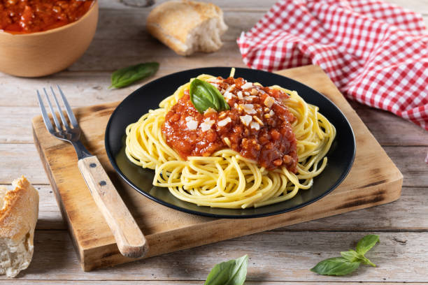 istock Spaghetti with bolognese sauce on wooden table 1471612231