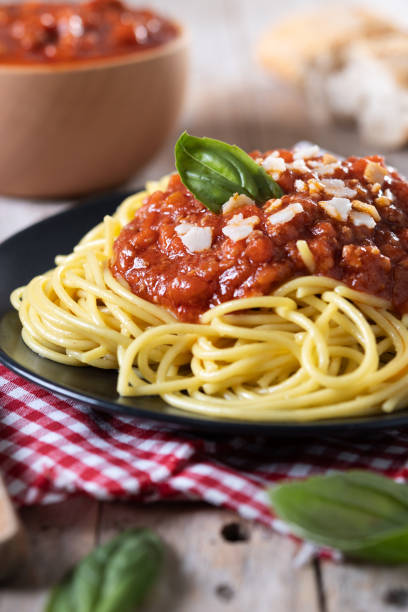 istock Spaghetti with bolognese sauce on wooden table 1471612255