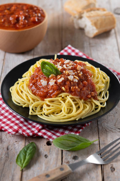istock Spaghetti with bolognese sauce on wooden table 1471612274