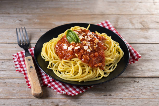 istock Spaghetti with bolognese sauce on wooden table 1471612331