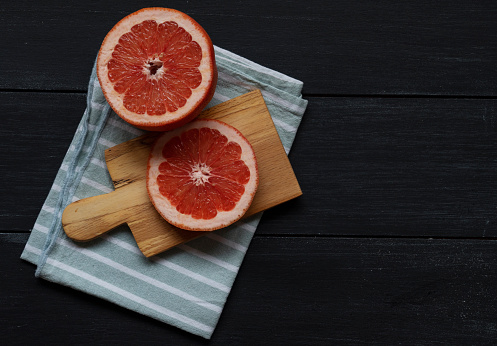 Grapefruit on wood background