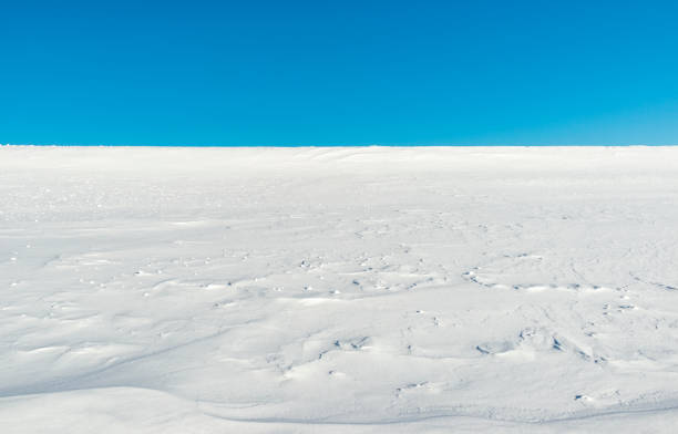 Snowy field and blue sky abstract backgrounds.