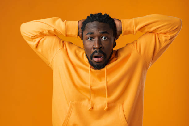 istock Young african anxious man worried nervous fail problem over yellow background 1471616920