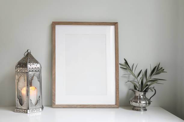istock Ramadan Kareem still life. Morrocan lantern, olive tree branches in silver jug, vase. Blank wooden picture frame mockup. Iftar dinner. Eid mubarak, Eid ul Fitr holiday celebration. Festive background. 1471617961