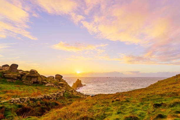 istock Lands End coastline landscape, with the Longships Lighthouse, Cornwall 1471618932