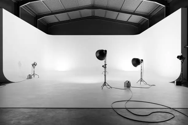Professional photography studio with lighting equipment and white cyclorama