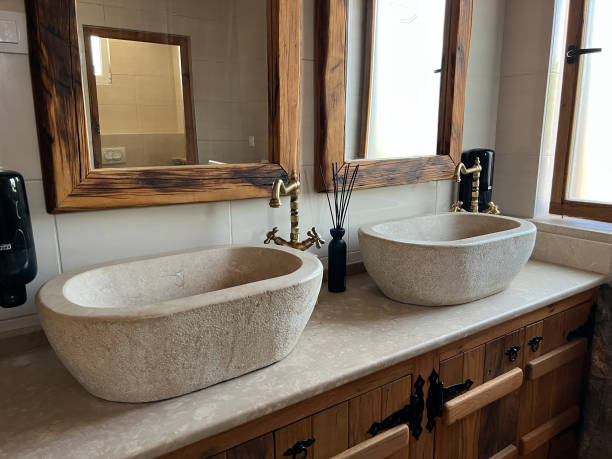 istock Bronze faucets over stone wash basins in the bathroom 1471620091