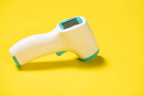 Digital Thermometer isolated on yellow background