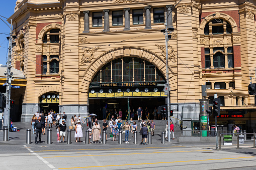 Melbourne, Australia-November 11, 2015: Flinders street station is Melbourne's main rail hub and train station. Public Transport serves metropolitan areas of Melbourne, Australia. The system combines buses, light rail, and trains and unites the urban and suburban regions of greater Melbourne. The system combines paid and free fare transit options. Image shot around downtown Melbourne during November 11, 2015.