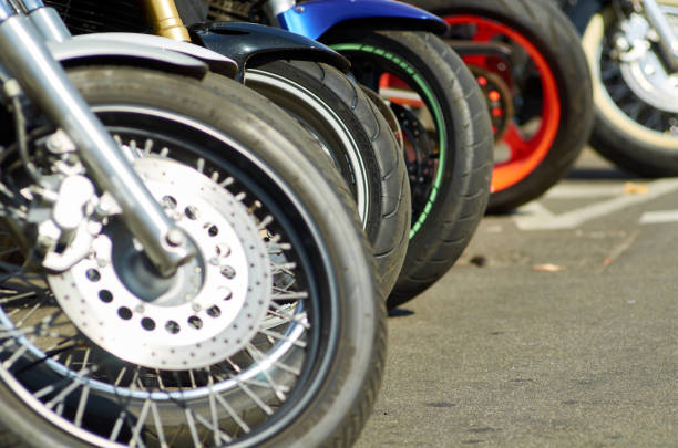 istock Wheels of motorcycles parked in a row 1471624102