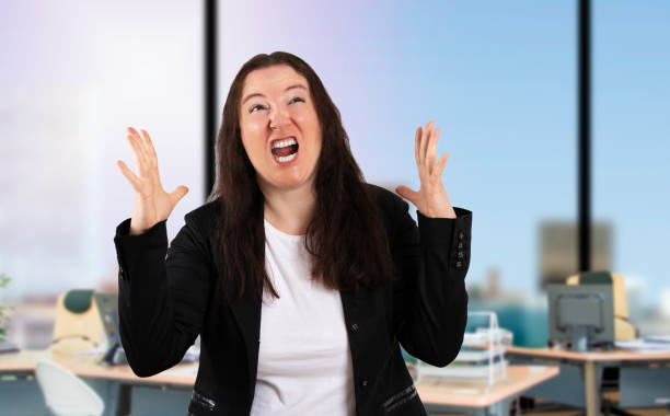 istock business woman shouting with aggressive expression 1471626268