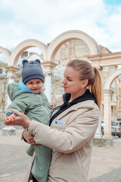 istock Happy mom holds baby in her arms 1471627762