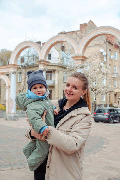 istock Happy mom holds baby in her arms 1471627778