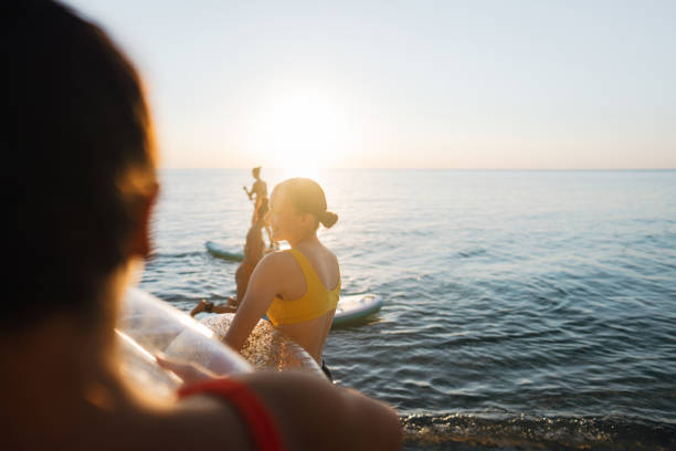 istock Sunset SUPing and swimming 1471628003