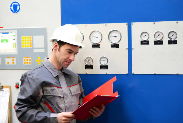 istock industrial workers inspect the technology of a plant for function - assembler in working clothes 1471628404