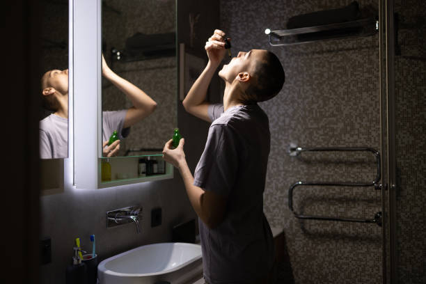 istock Woman using cannabis oil at night 1471630340