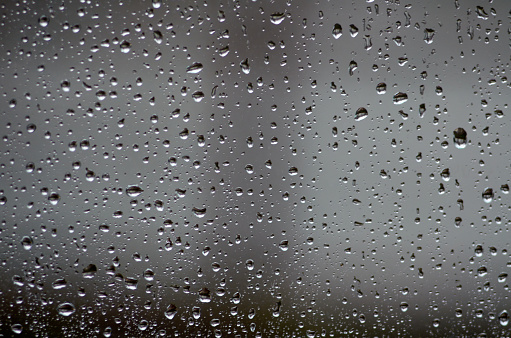 Water backgrounds with water drops on window glass