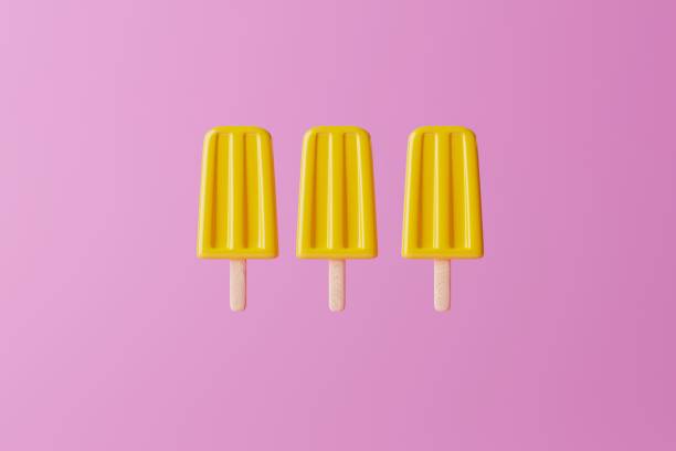 istock Yellow ice lolly on an pink background. 1471631657