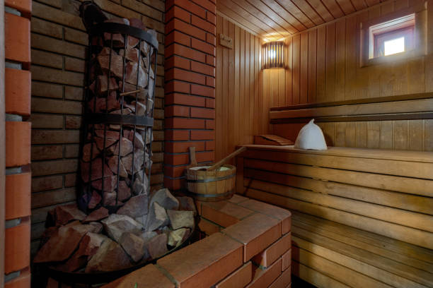 istock Sauna steam bath inside with stones and stove 1471635571