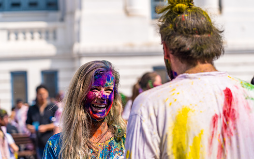 Group of tourist's exchange greetings of joy and happiness with celebrating color festival Holi at Kathmandu, Nepal, on  Monday March 06, 2023