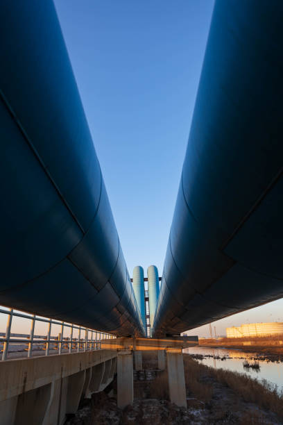 istock Blue pipes going to oil refinery at sunset 1471636275