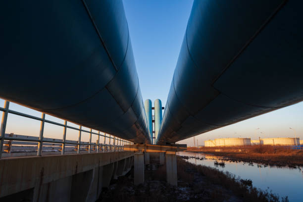 istock Blue pipes going to oil refinery at sunset 1471636280