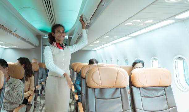 istock Flight attendant check the order of the passenger's luggage storage. 1471639396
