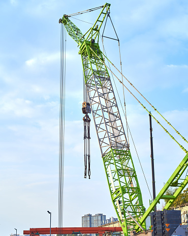 A green crane at work