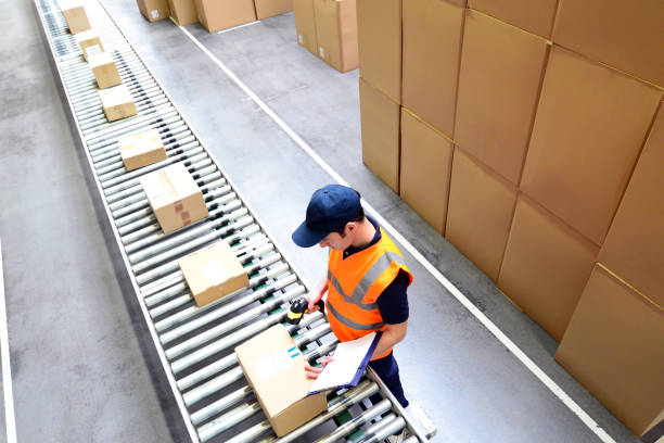 istock workers in a goods warehouse - storage and transport of goods by mail order 1471643295