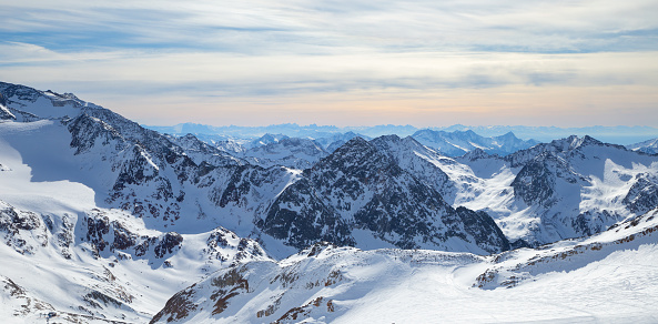 Stubai Glacier Alps mountain snowy range in the background of cloudy sky