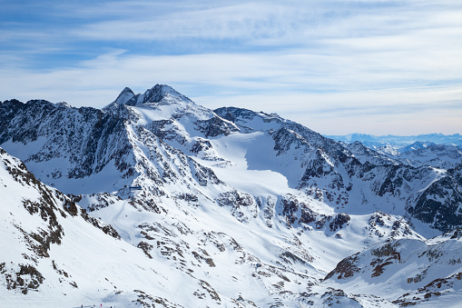 Stubai Glacier Alps mountain snowy range in the background of cloudy sky