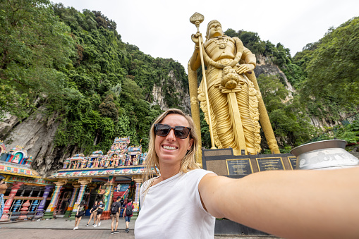 Hindu temple called Batu caves near the city, she travels by herself and discover the sights and cultures.