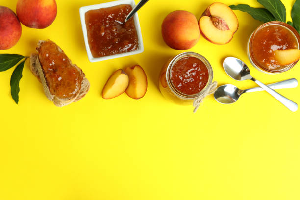 istock Peach jam and ingredients on yellow background 1471649041
