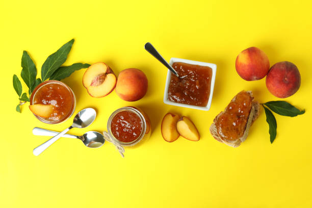 istock Peach jam and ingredients on yellow background 1471649100